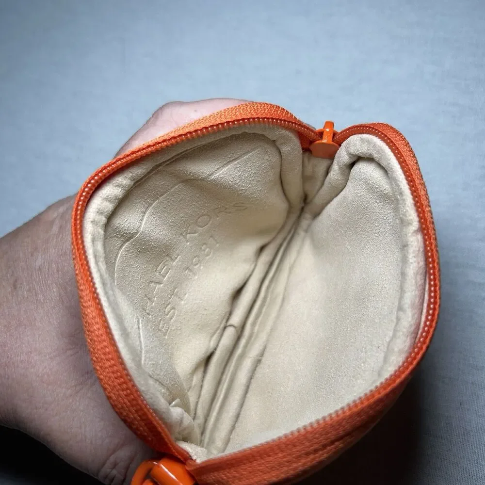 bright orange Michael Kors neoprene wristlet with a matching strap